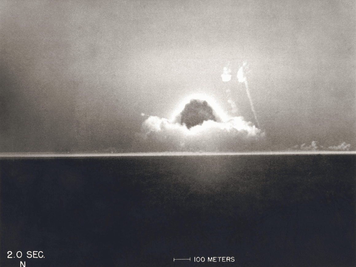 First Atomic Explosion on July 16, 1945. Photograph taken at 2 seconds after the initial Trinity detonation shows the beginning of the Mushroom cloud. Manhattan Project, World War 2. Alamogordo, New Mexico. (BSLOC_2014_6_67)