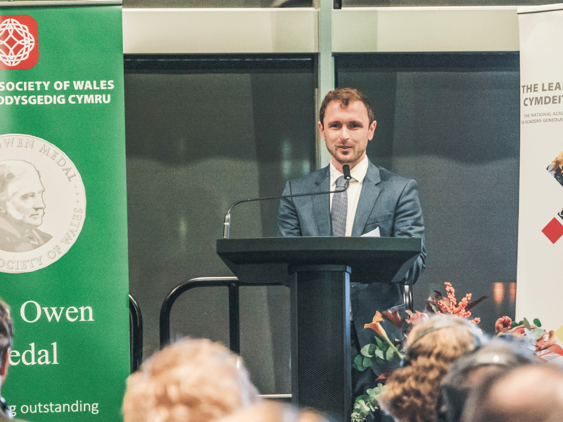 Dr Iestyn Woolway talking at the Senedd in 2023 after receiving the Learned Society of Wales Dillwyn Medal.